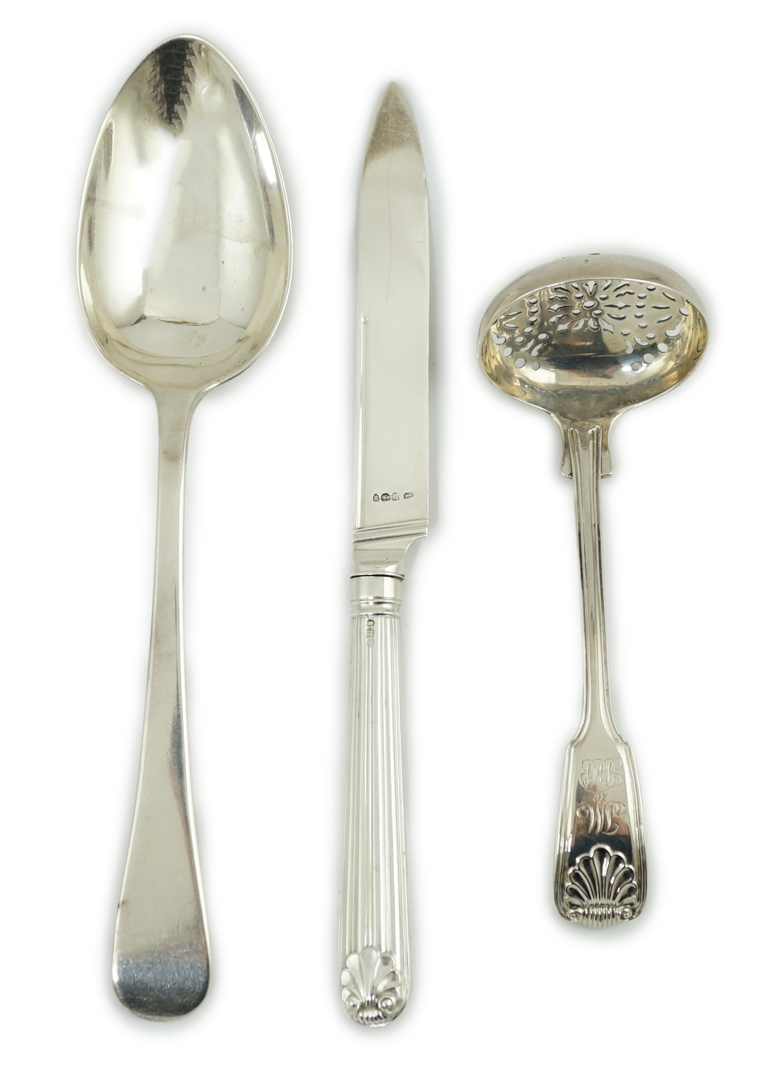 Paul Storr. A George III silver fiddle, thread and shell pattern sifter ladle, London, 1815, 13.9cm, a similar Old English pattern table spoon, London, 1818, 21.2cm, 4oz and a dessert knife, London, 1812.